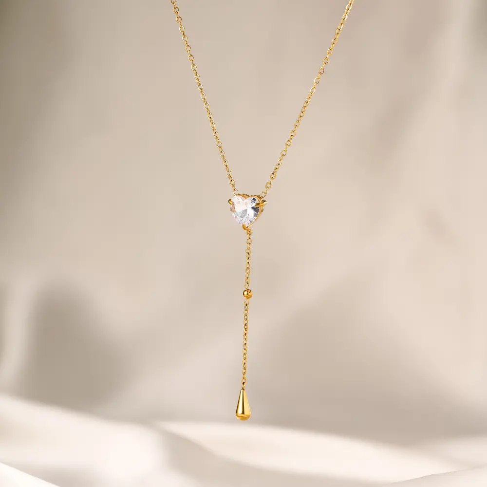 Corazon brillante con gota colgante