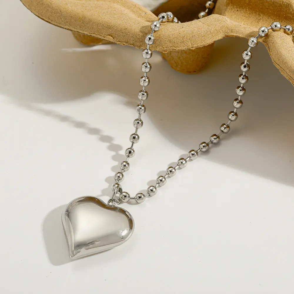 Corazon plateado con balines
