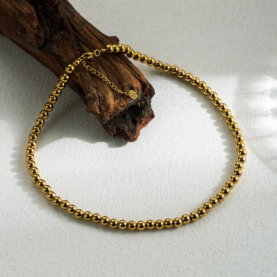 Collar de balines dorado